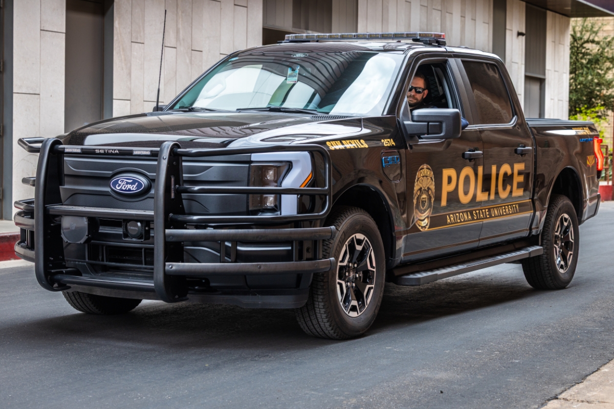 Man driving a truck that says